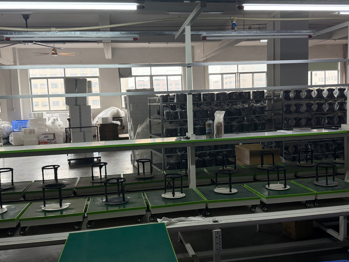 Worktables and fan components inside the Breeze and Beam factory in Zhongshan